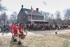 crowd in front of cedar Bridge watches firing