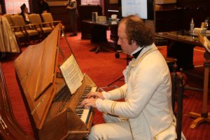 20024 man plays harpsichord