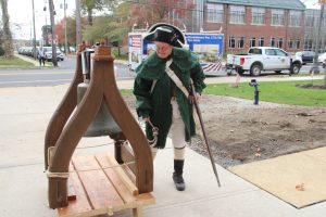 Wendy Lucas of First NJ Volunteers stands at Dan Soper Liberty Bell