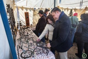 2025 patrons examine black smith tent