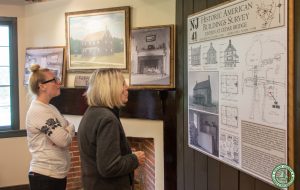 two guest examine HABS display