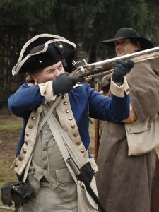 Period soldier fires weapon