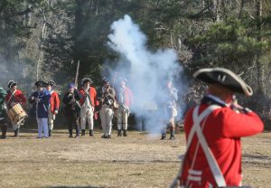 one loyalist fires at line of Patriots