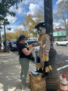 Alex Smith with Joshua Huddy scare crow in Toms River by library