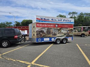Trailer with over sign at Monmouth parade