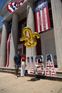 07.04.2026 Commissioners Rob and Jennifier stand by the USA display