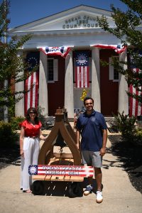 07.04.2026 Commissioners Rob and Jennifier stand by Soper Liberty Bell