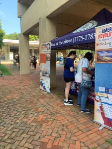 2026 Monmouth 5k - booth with visitors