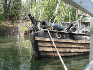 quarter galley with cannon on bow from water