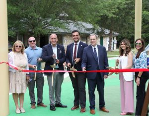 Ribbon cutting ceremony of the new playground at Eno's Pond County Park