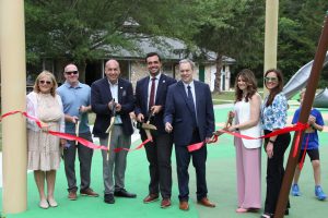 Ribbon cutting ceremony of the new playground at Eno's Pond County Park