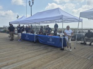 Ocean County Commissioner Robert Arace joins the NJ Attorney General's Office and the Ocean County Consumer Affairs Department to promote safe summers on the Seaside Boardwalk