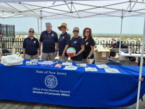 Ocean County Commissioner Robert Arace joins the NJ Attorney General's Office and the Ocean County Consumer Affairs Department to promote safe summers on the Seaside Boardwalk