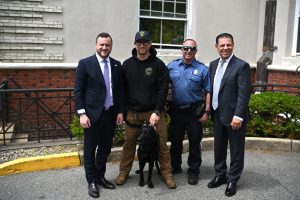Ocean County Commissioners Frank Sadeghi and Sam Ellenbogen with police officers