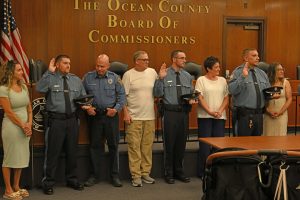 Ocean County Commissioners Sam Ellenbogen and Ray Gormley welcomed 10 new Corrections Officers to Ocean County during a swearing in ceremony on June 10. Ellenbogen and Gormley, liaisons to the Ocean County Corrections Department, administered the oath to the new officers.